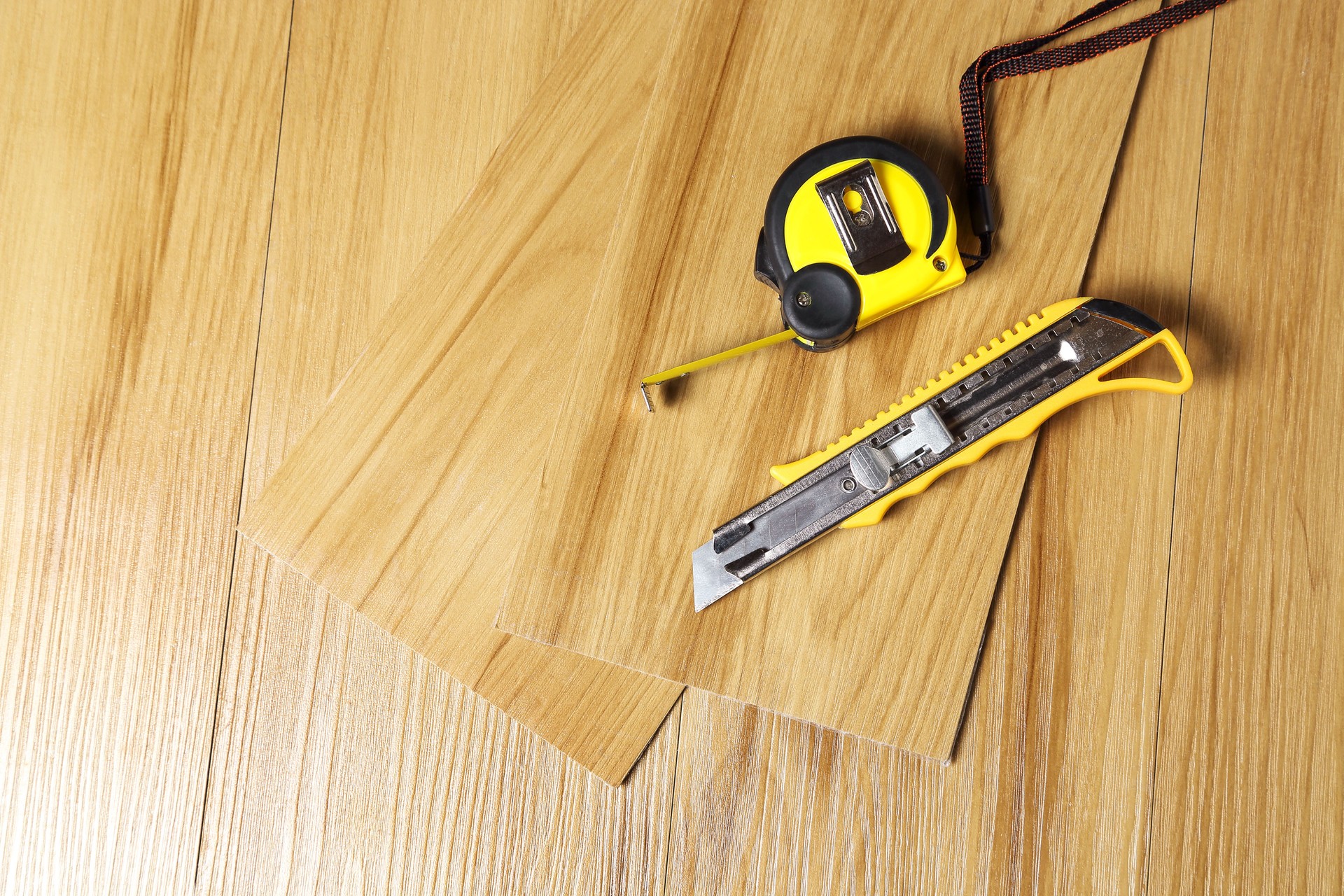 pvc floor tiles with cutter and measuring tape